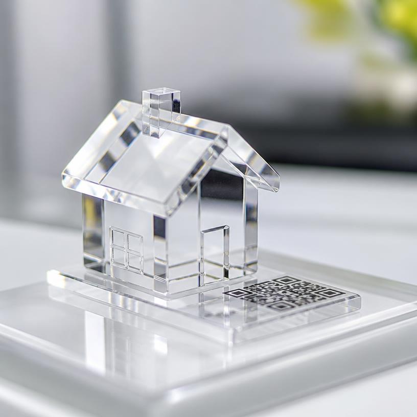 Clear acrylic finish shown on a miniature house with a QR base