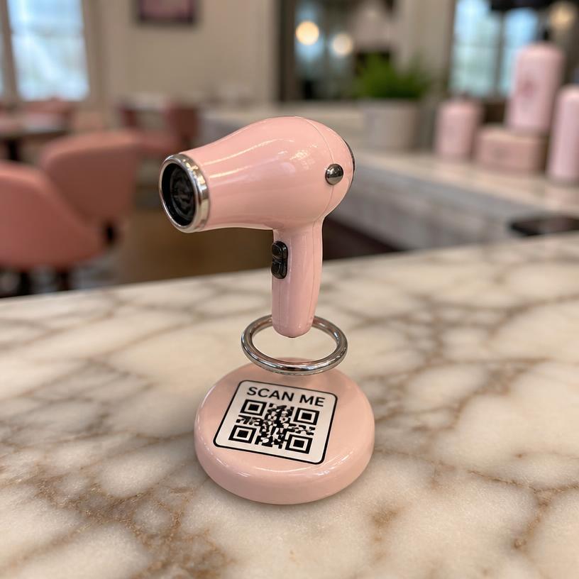 Miniature hair dryer with a SCAN ME QR base