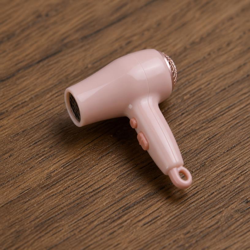 Miniature hair dryer — a tiny freestanding Scanature with the QR code hidden on its underside