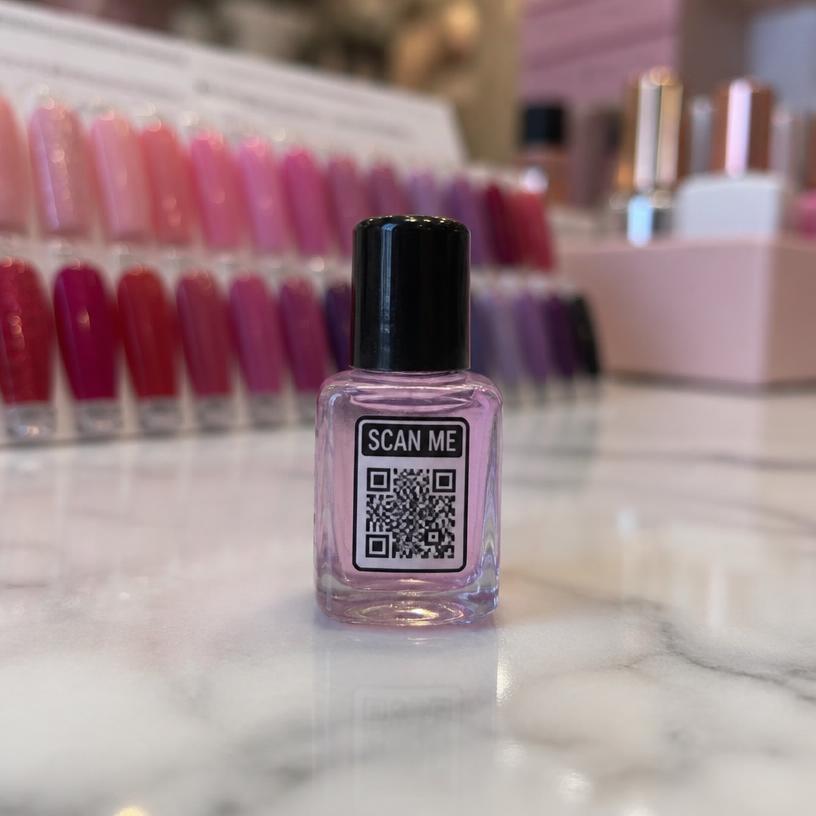 Miniature nail polish bottle with a SCAN ME QR base