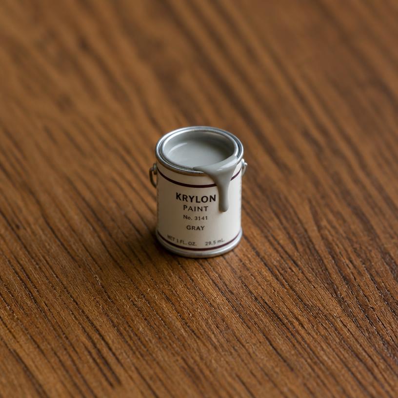 Miniature paint can — a tiny freestanding Scanature with the QR code hidden on its underside