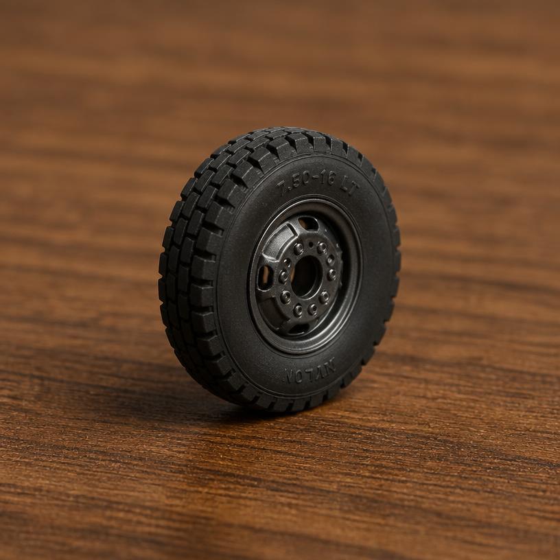 Miniature tire — a tiny freestanding Scanature with the QR code hidden on its underside